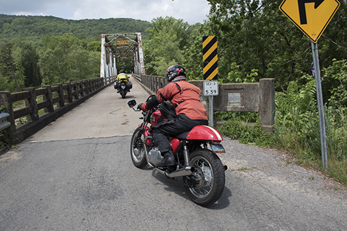 Rider crossing  the AR 123 bridge across Big Piney