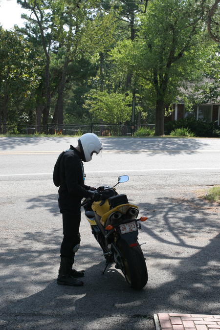 Man standing at motorcycle